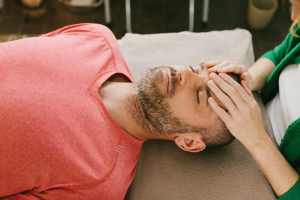 Man receiving Craniosacral Therapy