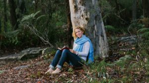 BeccyHowe leaning against a tree for her Nature sessions and Forest Bathing